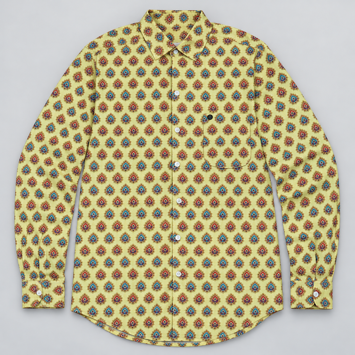 Yellow red and teal medallion full sleeve pocket shirt with small black round pocket badge — dimensional product front