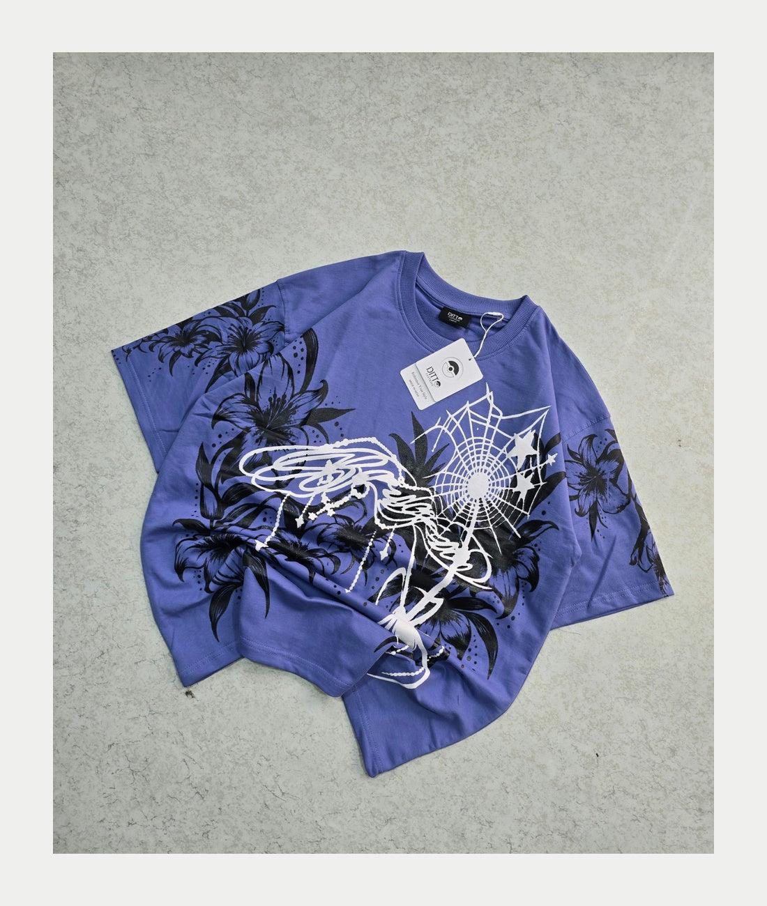 Lavender Blue floral spiderweb graphic oversized T-shirt, original physical product front photograph