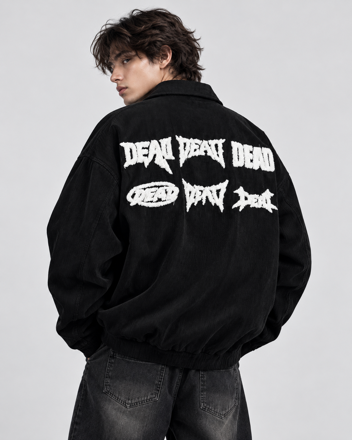 Black zip-up collared shirt - model wearing the white graphic back design