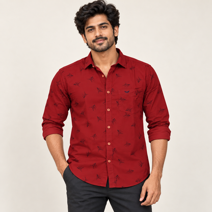 Adult model wearing brick red outlined kite print full sleeve wing pocket shirt, sleeves rolled, front view