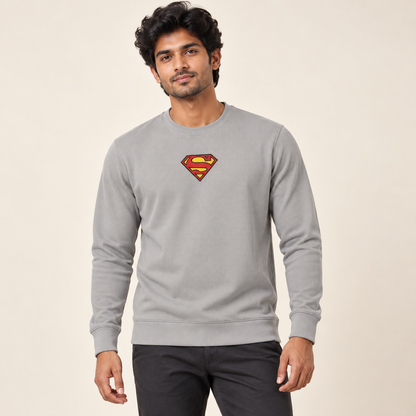 Light grey textured long sleeve crew neck sweatshirt with the original red and yellow shield graphic on an adult male model.