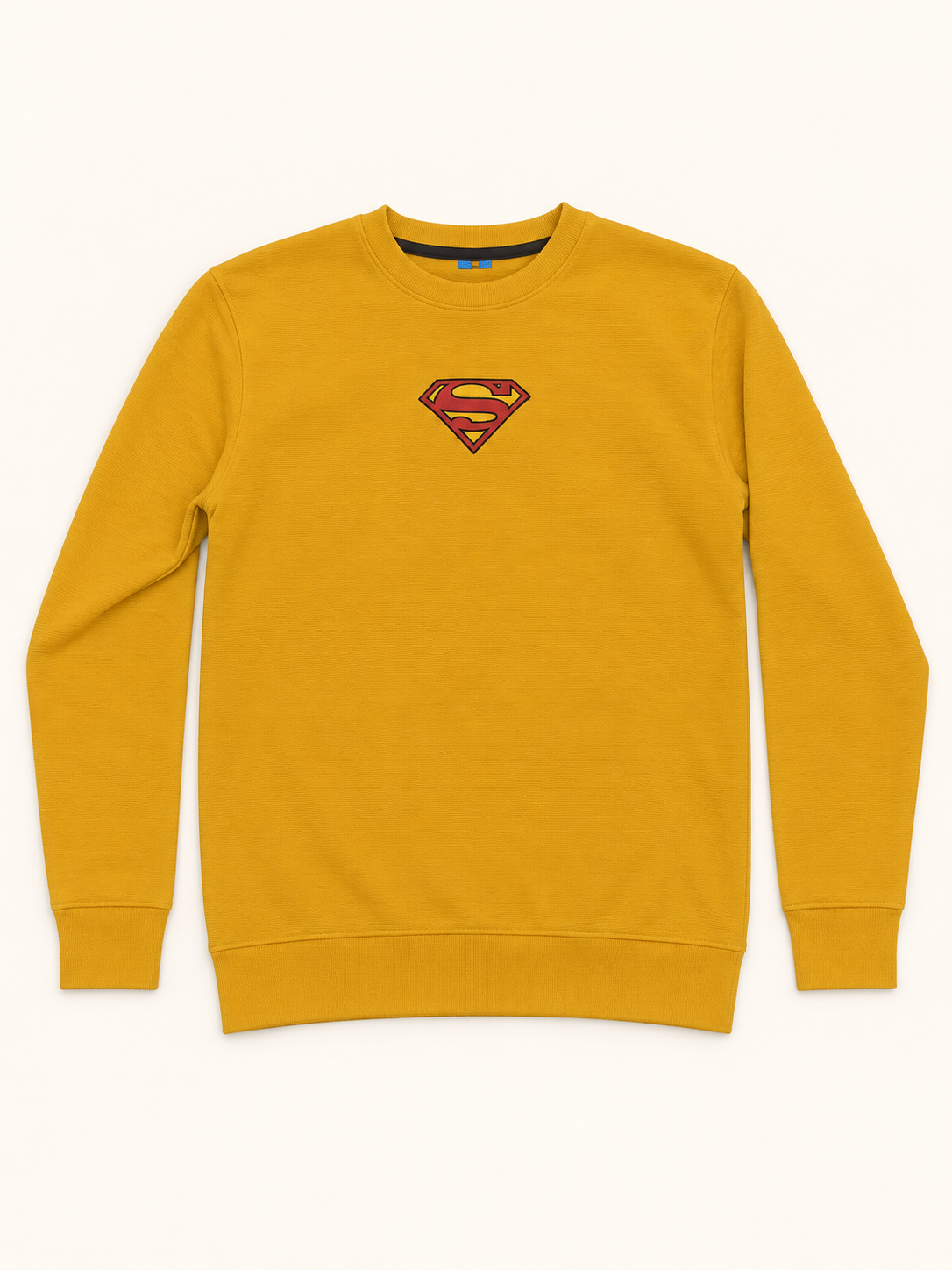 Mustard crew neck sweatshirt with a small red and yellow shield chest graphic, full sleeve cuffs and ribbed hem.