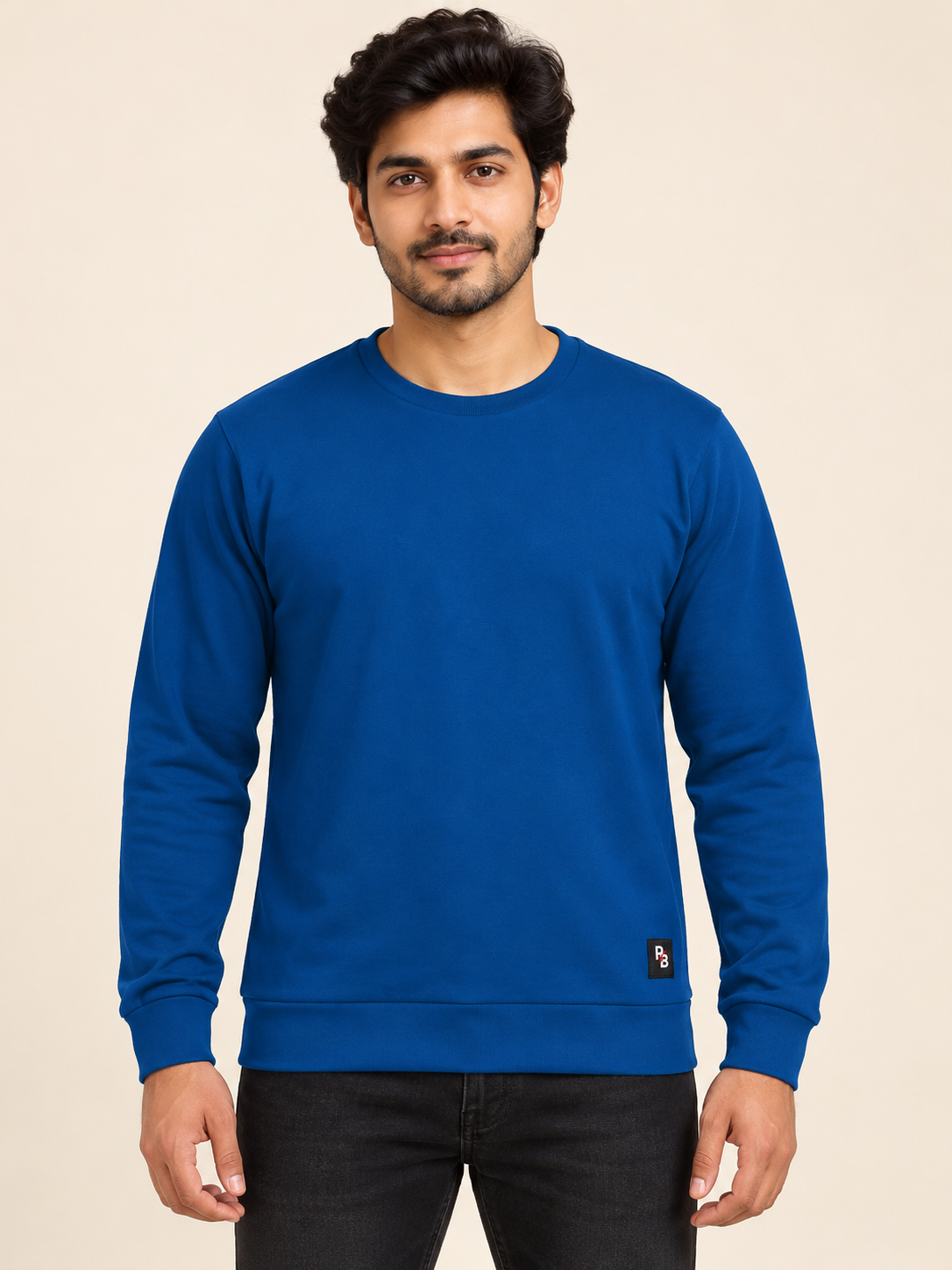 Hem Patch Crew Neck Sweatshirt - Blue on an adult male model, front view.