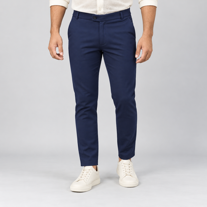Navy blue textured ankle-fit pants on an adult male model, full front view.