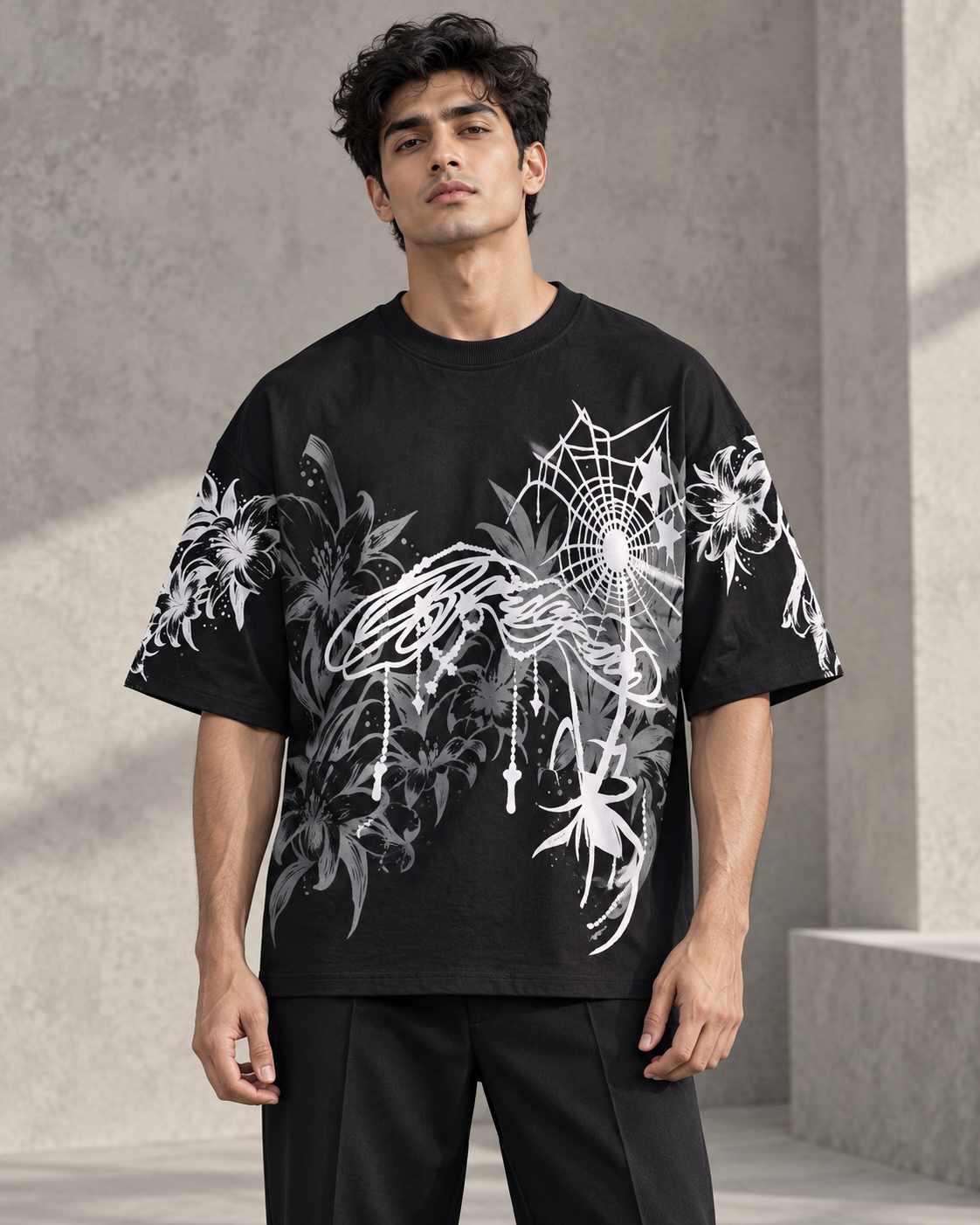 black floral spiderweb oversized T-shirt worn by a model, front view