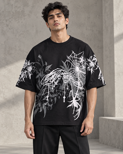 black floral spiderweb oversized T-shirt worn by a model, front view