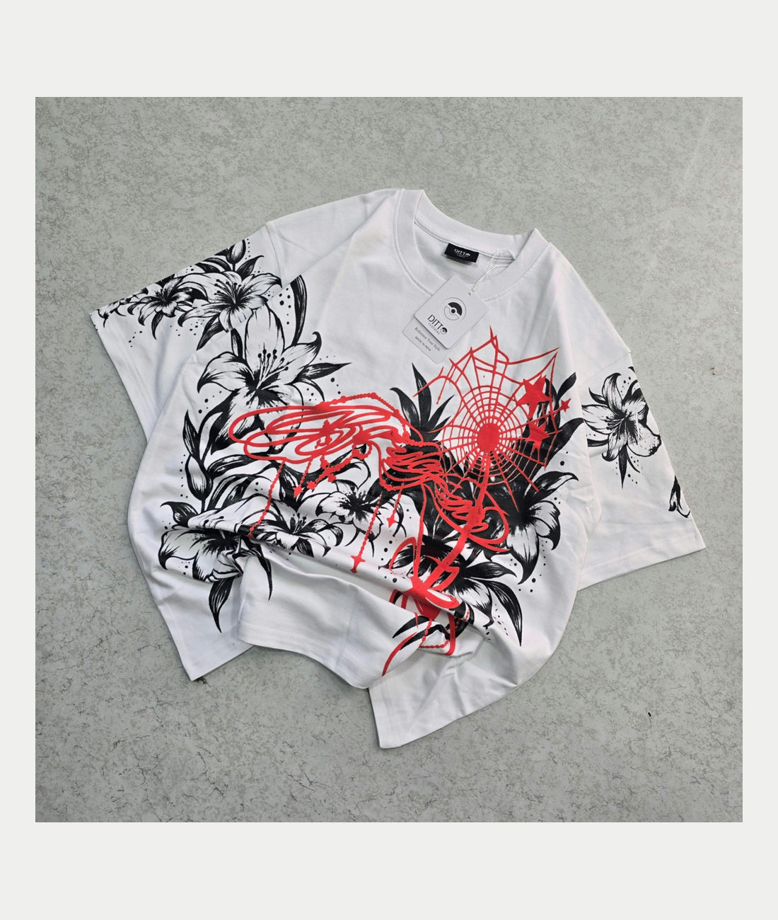 White floral spiderweb graphic oversized T-shirt, original physical product front photograph