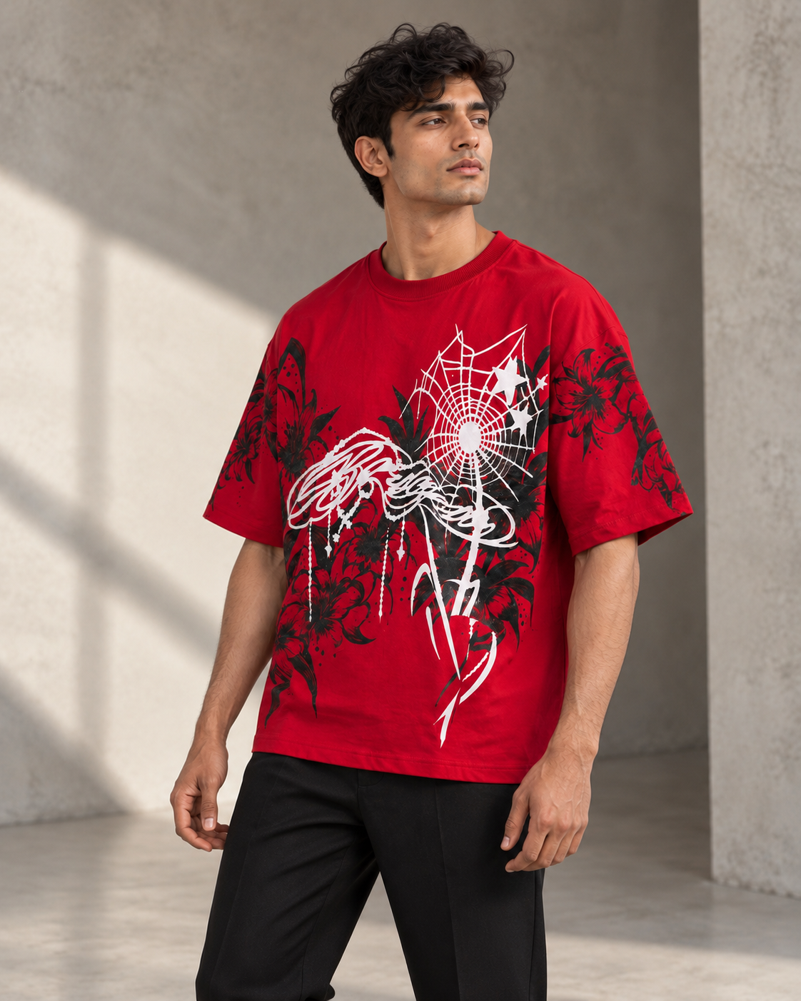 red floral spiderweb oversized T-shirt worn by a model, three-quarter front view
