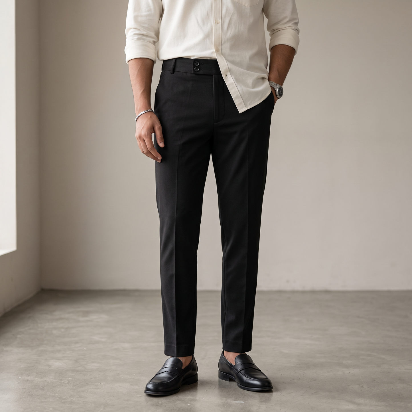 Black double button ankle fit pant on model