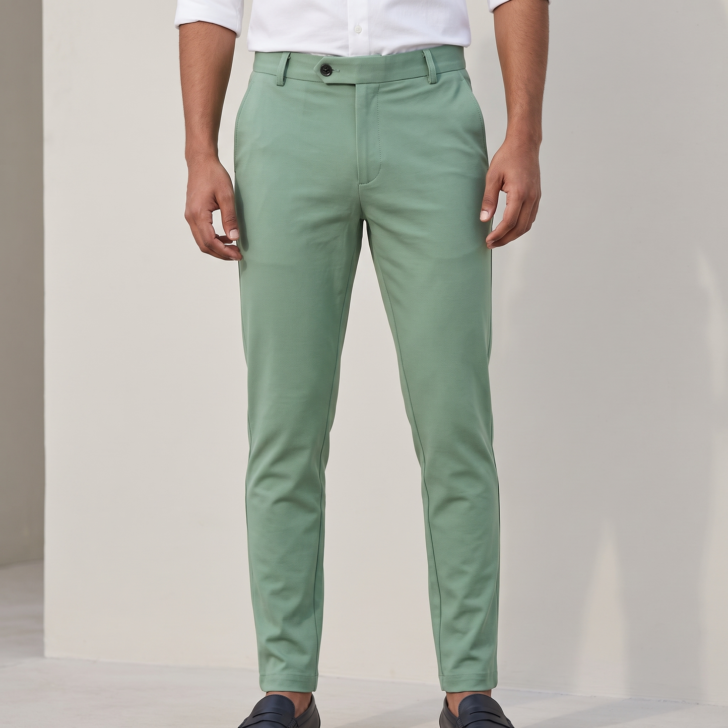 Light green double button ankle fit pant on model